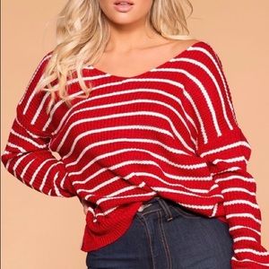 Red and white twist back sweater.
